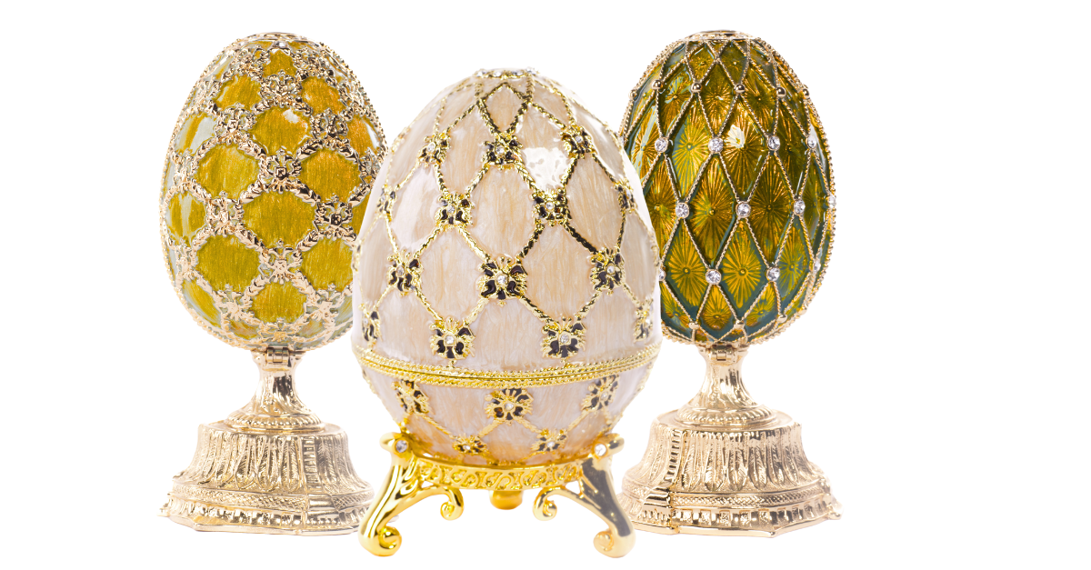 Three Fabergé style eggs with gold embellishments