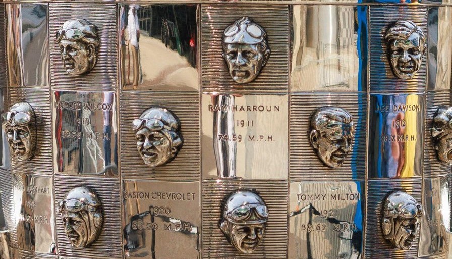 Close-up photo showing Indy 500 winners on the surface of the Borg-Warner trophy